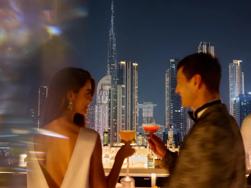 A couple enjoying drinks at High Society