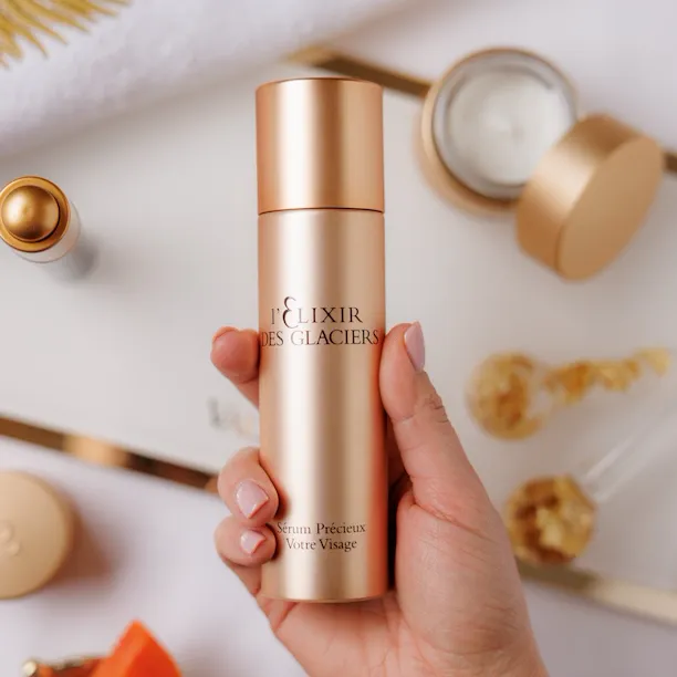 Close up on Elixir des Glacier product, on the back ground papaya and spa tools at The Eden Spa