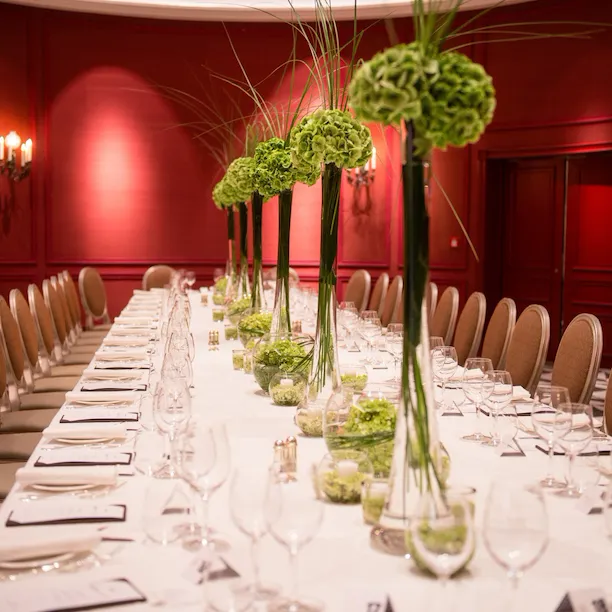 Imperial table banqueting setup with flower arrangements for private dining at Sala Borghese at Hotel Eden, Rome