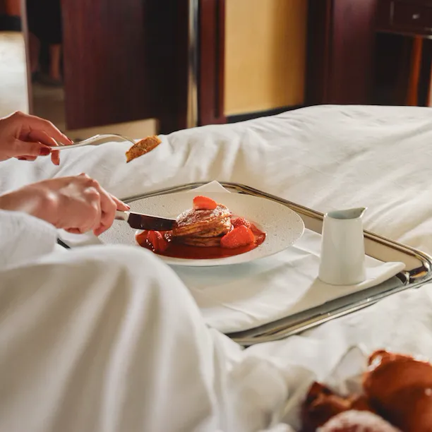 Woman looking out window of Park Lane Studio