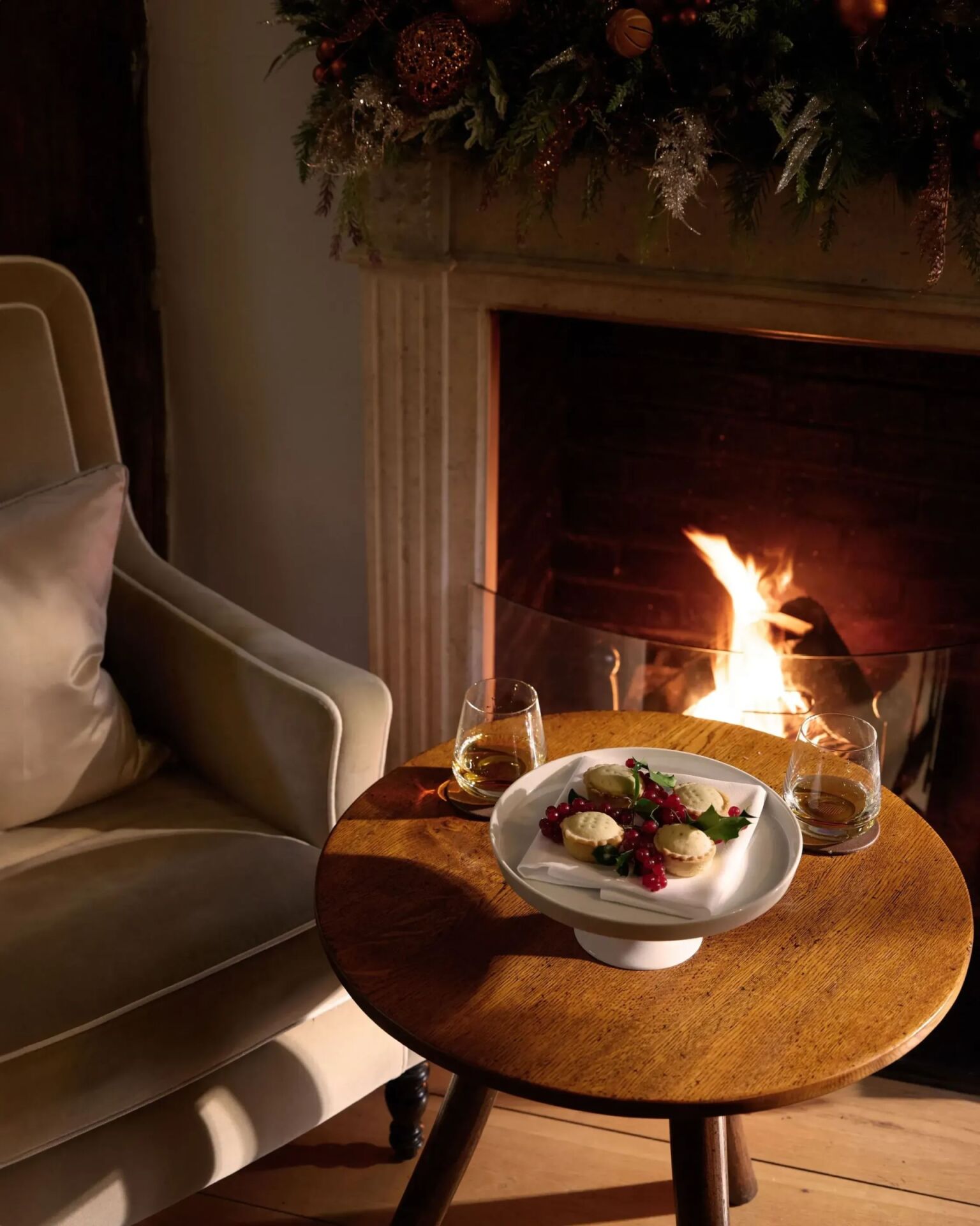 festive dining at Coworth Park in front of a fireplace