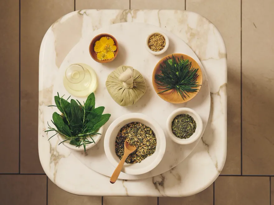 Close up of marble tray with alpine herbs suitable for treatments