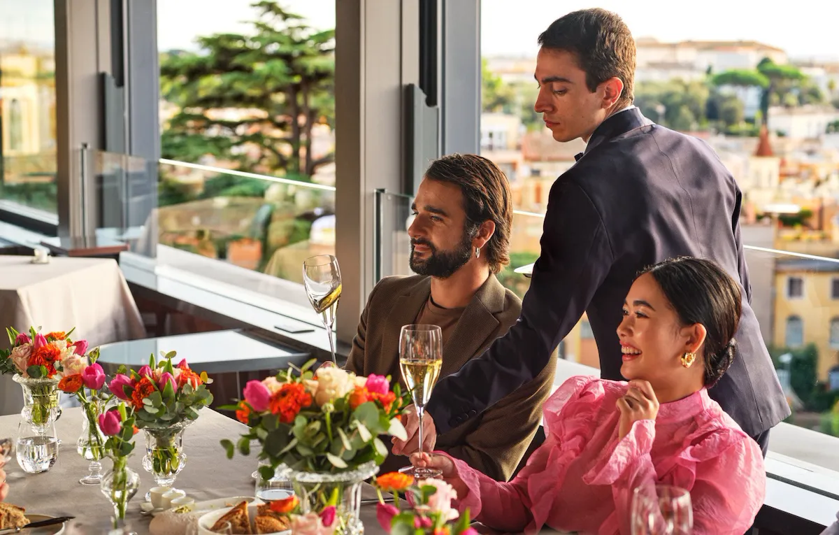 Waiter serving a twosome at La Terrazza