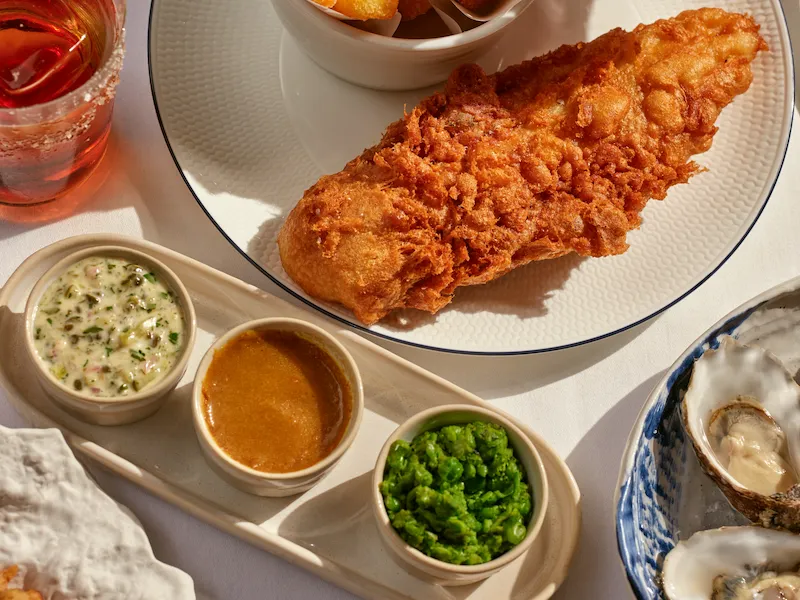 Fish and chips with sides and oysters, flat-lay dining spread at 45 Park Lane