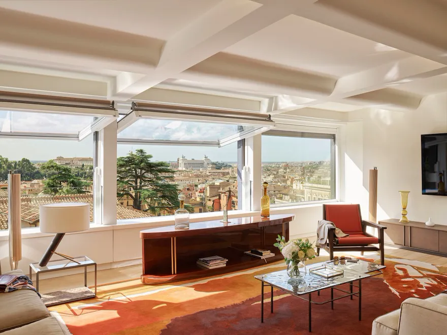Bellavista Penthouse Suite living room with windows open and view at Hotel Eden, Rome