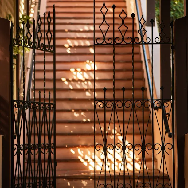Gated entrance to stairway and The Bell Suite