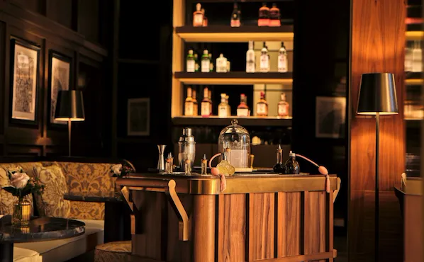 Bitter Honey bar interior with wooden drinks trolley at The Lana, Dubai