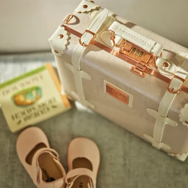 children shoes and suitcase