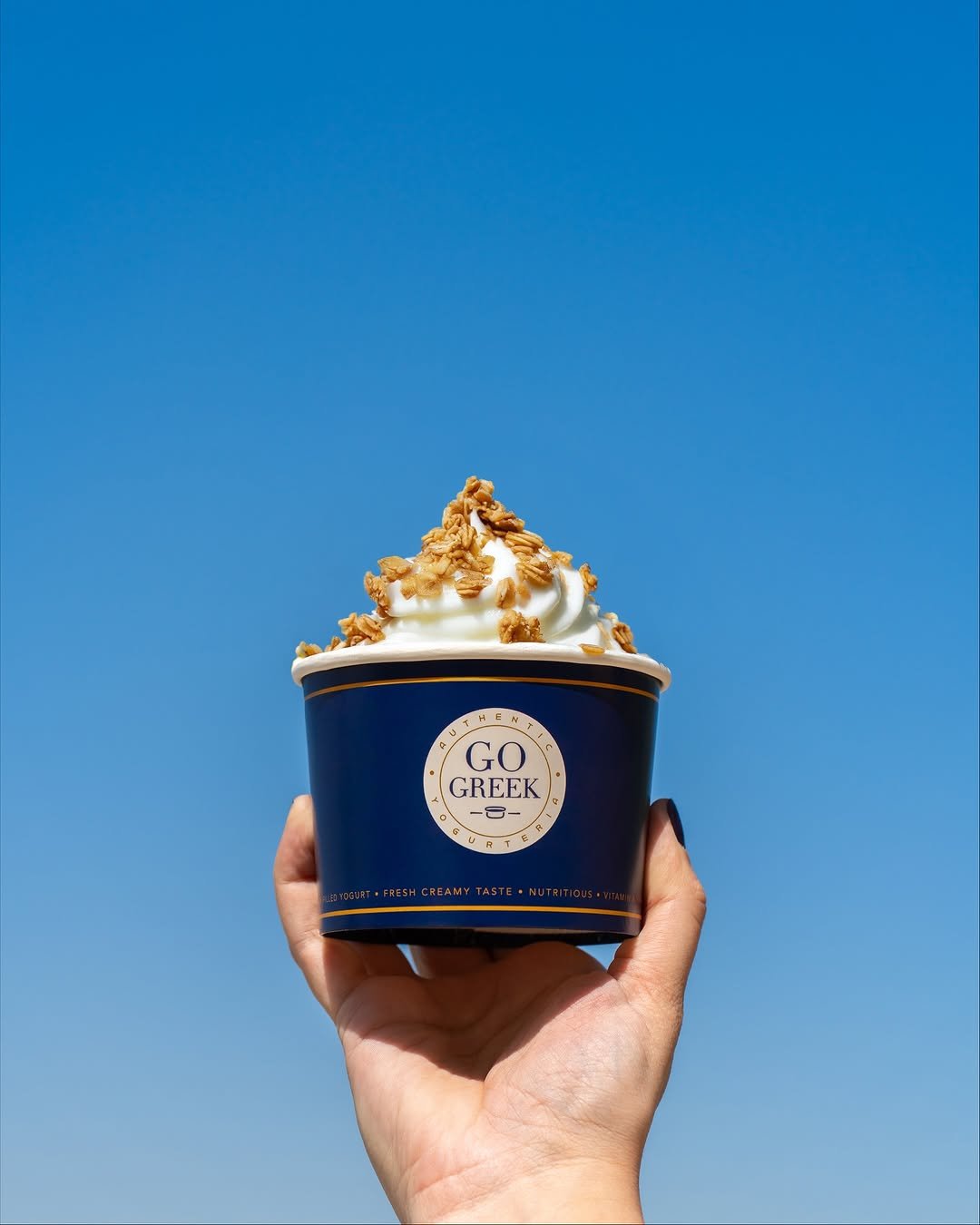 The-Beverly-Hills-Hotel-Go-Greek-Yogurt-hand-toppings-dorchester-collection
