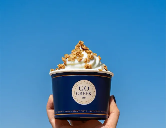 The-Beverly-Hills-Hotel-Go-Greek-Yogurt-hand-toppings-dorchester-collection
