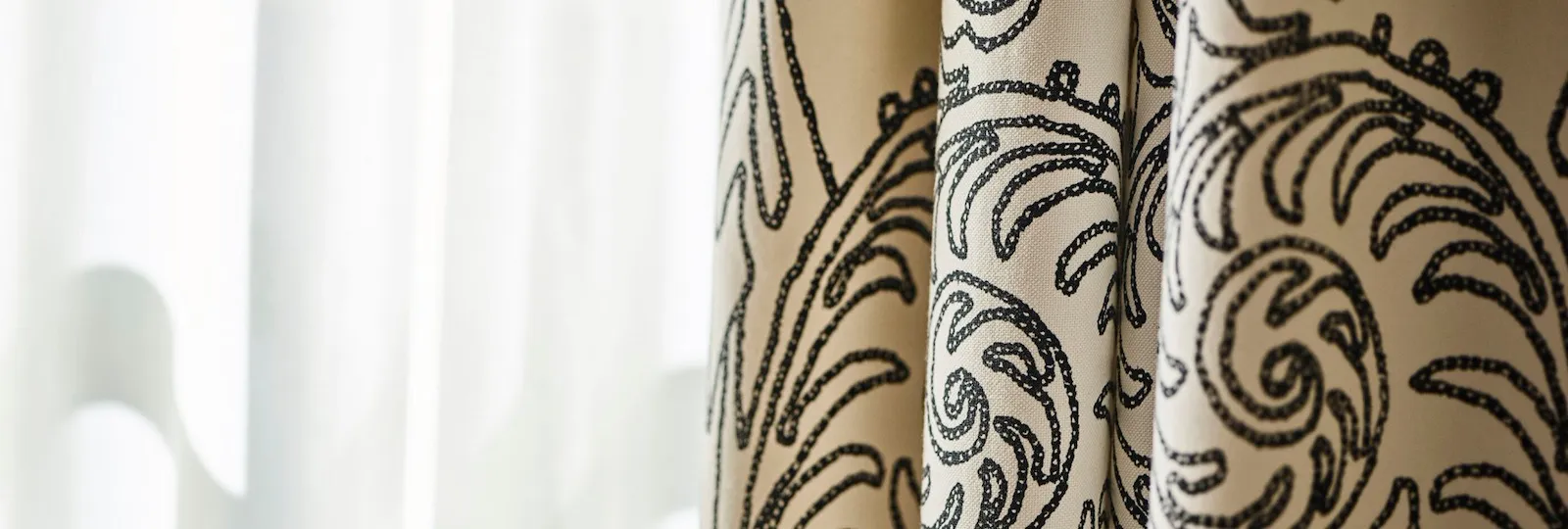 Sun shining through window with curtain closeup