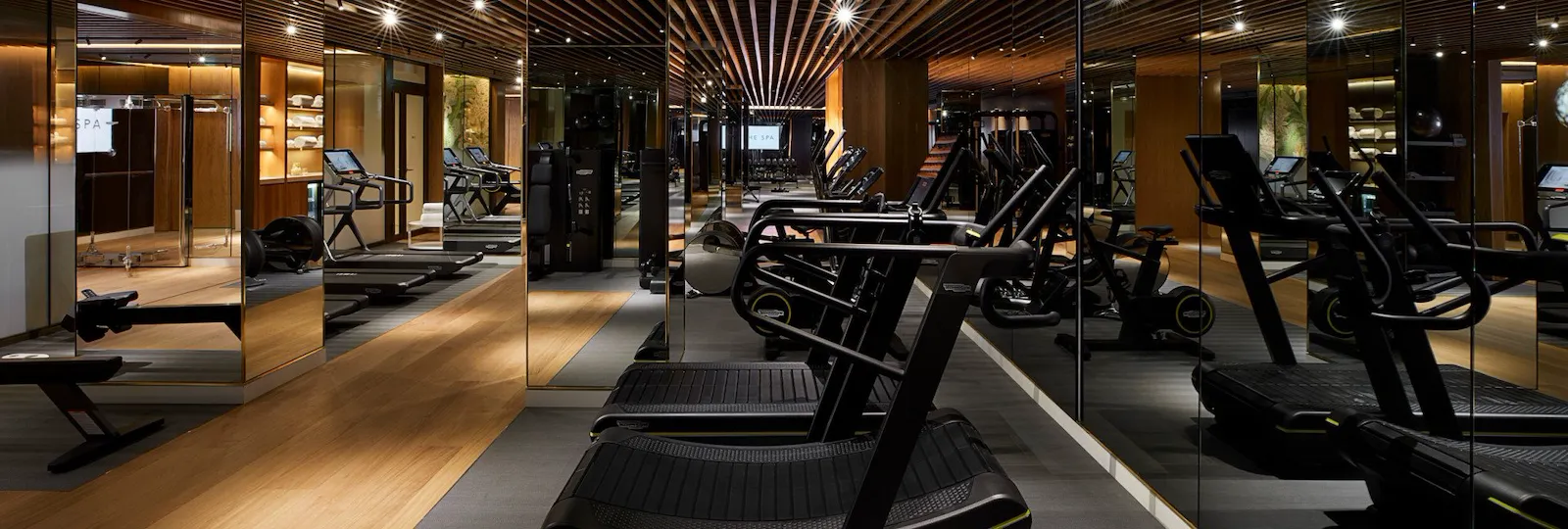 Curved treadmills in the gym at The Spa at 45 Park Lane/Mayfair Park Residences, London