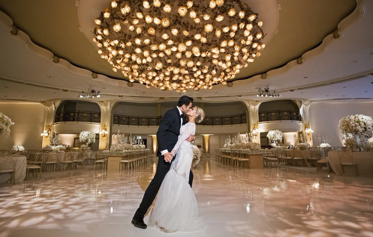 Wed couple kissing each other