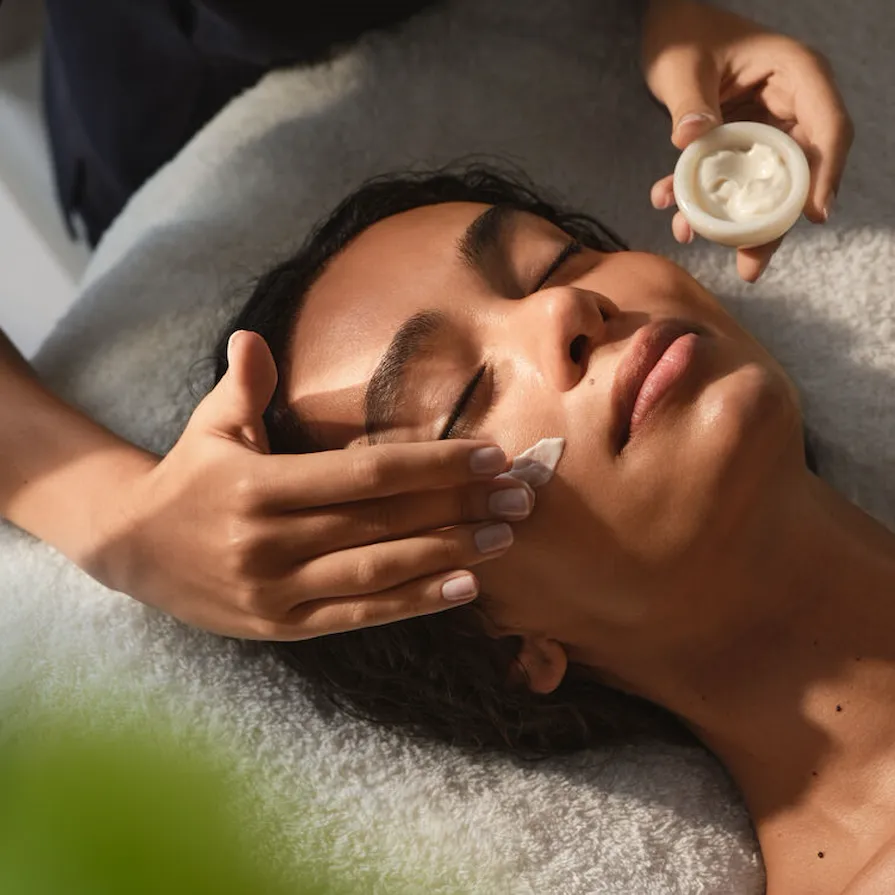 Facial treatment being completed on the female model
