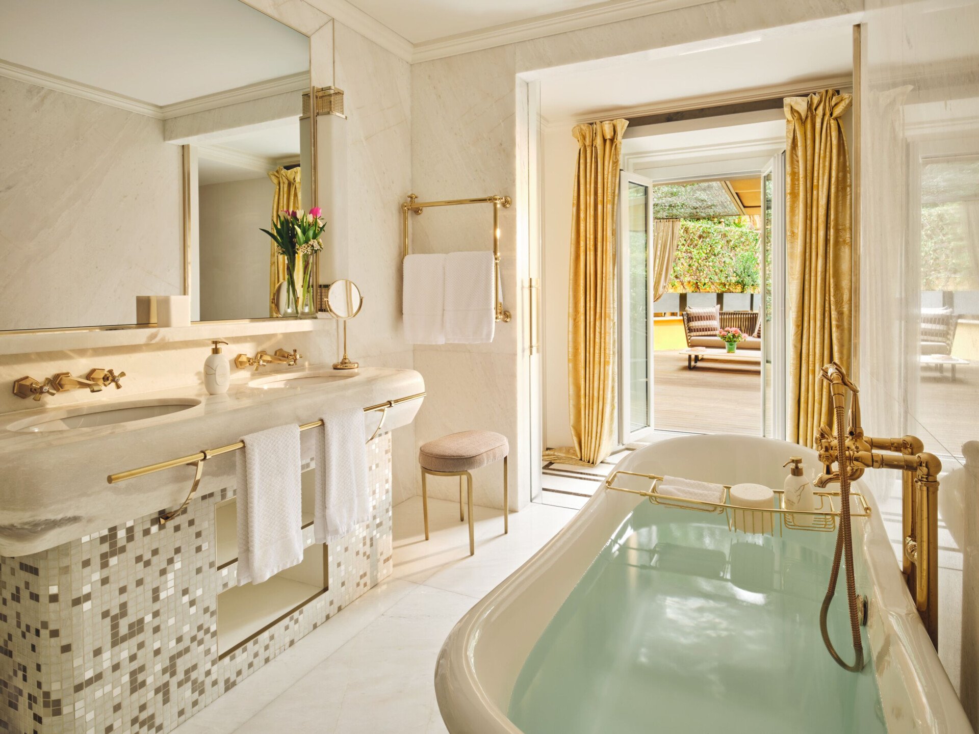 Aurora Terrace Suite bathroom with view on terrace and bathtub filled with water