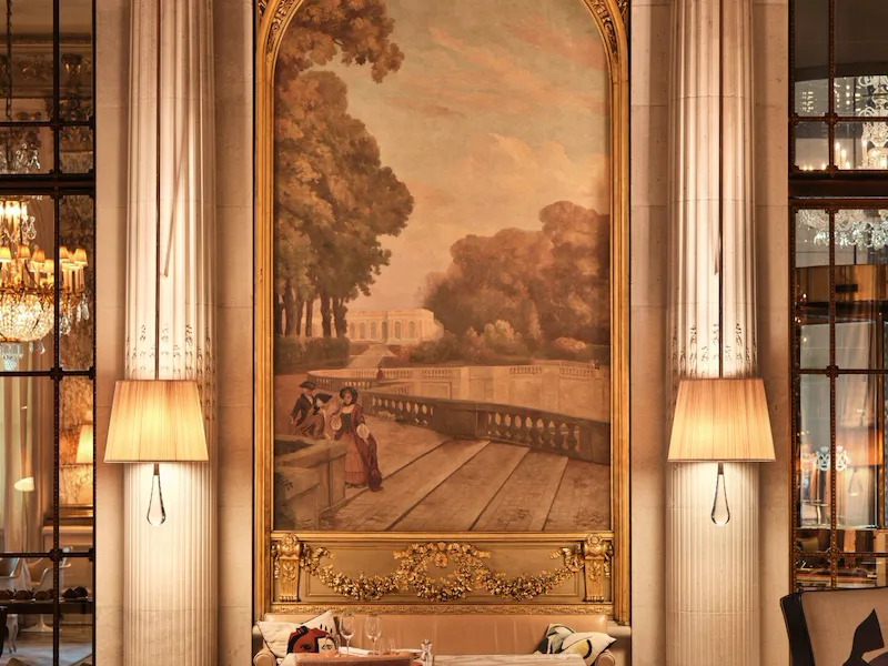 Focus on a painting overhead a table and between two lamps in the restaurant Le Dali, at Le Meurice, Paris